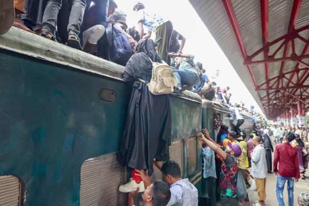 May 26, 2026, Tongi, Bangladesh: Bangladeshi Muslim passengers struggle to board an overcrowded train as they travel home ahead of the upcoming Eid al-Adha festival at a railway station in Tongi, near Dhaka, Bangladesh, Monday, May 26, 2024. Millions of people are expected to leave the capital in one of the countryÃ¢â‚¬â ¢s largest annual holiday exoduses to celebrate Eid with their families in rural areas. Tongi Bangladesh - ZUMAd117 20260526_fap_d117_044 Copyright: xSuvraxKantixDasx