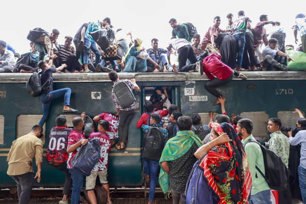 May 26, 2026, Tongi, Bangladesh: Bangladeshi Muslim passengers struggle to board an overcrowded train as they travel home ahead of the upcoming Eid al-Adha festival at a railway station in Tongi, near Dhaka, Bangladesh, Monday, May 26, 2024. Millions of people are expected to leave the capital in one of the countryÃ¢â‚¬â ¢s largest annual holiday exoduses to celebrate Eid with their families in rural areas. Tongi Bangladesh - ZUMAd117 20260526_fap_d117_045 Copyright: xSuvraxKantixDasx