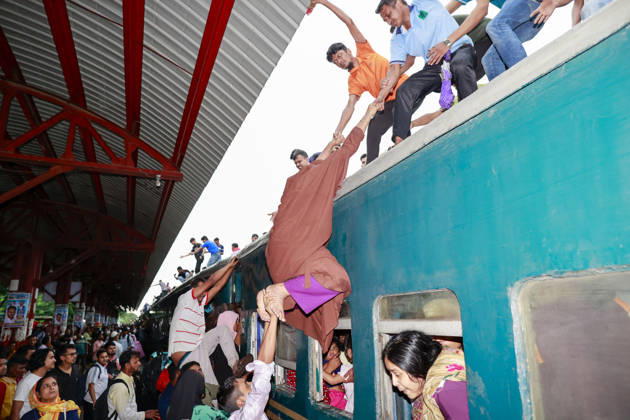 May 26, 2026, Tongi, Bangladesh: Bangladeshi Muslim passengers struggle to board an overcrowded train as they travel home ahead of the upcoming Eid al-Adha festival at a railway station in Tongi, near Dhaka, Bangladesh, Monday, May 26, 2024. Millions of people are expected to leave the capital in one of the countryÃ¢â‚¬â ¢s largest annual holiday exoduses to celebrate Eid with their families in rural areas. Tongi Bangladesh  - ZUMAd117 20260526_fap_d117_036 Copyright: xSuvraxKantixDasx