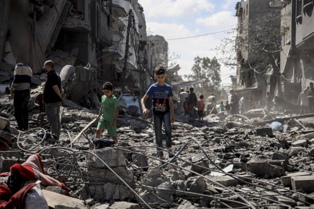 Nuseirat Homes Destroyed Airstrike Palestinian children walk through debris following an Israeli strike in Nuseirat in the central Gaza Strip on May 26, 2026. The strike came amid the ongoing war between Israel and Hamas, which has devastated large parts of the Gaza Strip and displaced much of its population. Nuseirat Gaza Strip Palestinian Territories Copyright: xAhmedxYounisx