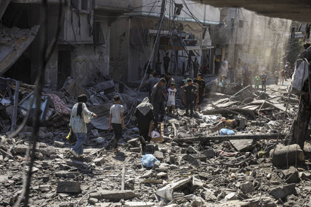 Nuseirat Homes Destroyed Airstrike Palestinian residents walk through debris following an Israeli strike in Nuseirat in the central Gaza Strip on May 26, 2026. The strike came amid the ongoing war between Israel and Hamas, which has devastated large parts of the Gaza Strip and displaced much of its population. Nuseirat Gaza Strip Palestinian Territories Copyright: xAhmedxYounisx