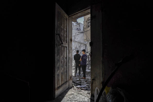 Nuseirat Homes Destroyed Airstrike Palestinian residents walk through debris following an Israeli strike in Nuseirat in the central Gaza Strip on May 26, 2026. The strike came amid the ongoing war between Israel and Hamas, which has devastated large parts of the Gaza Strip and displaced much of its population. Nuseirat Gaza Strip Palestinian Territories Copyright: xAhmedxYounisx