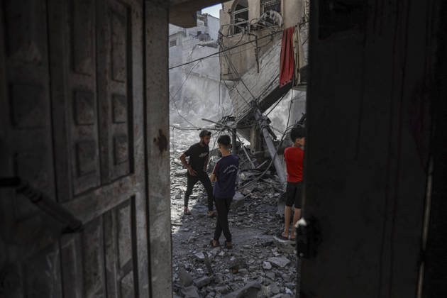 Nuseirat Homes Destroyed Airstrike Palestinian children walk through debris following an Israeli strike in Nuseirat in the central Gaza Strip on May 26, 2026. The strike came amid the ongoing war between Israel and Hamas, which has devastated large parts of the Gaza Strip and displaced much of its population. Nuseirat Gaza Strip Palestinian Territories Copyright: xAhmedxYounisx