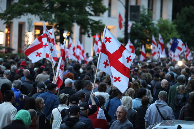 Anti-government protest in Tbilisi TBILISI, GEORGIA - MAY 26: Pro-EU demonstrators wave national flags of Georgia, the European Union, the United States, and Ukraine during an anti-government protest rally outside the Parliament Building on Rustaveli Avenue in Tbilisi, Georgia on May 26, 2026. Organized by the Opposition Alliance , a coalition of various pro-Western opposition political parties, the peaceful demonstration began in the evening hours outside the main entrance of Ivane Javakhishvili Tbilisi State University before marching through the central streets of the capital. Thousands of participants chanted anti-government slogans and accused the ruling party of executing ineffective foreign policies that threaten to derail Georgia s  Copyright: x2026xAnadoluxDavitxKachkachishvilix
