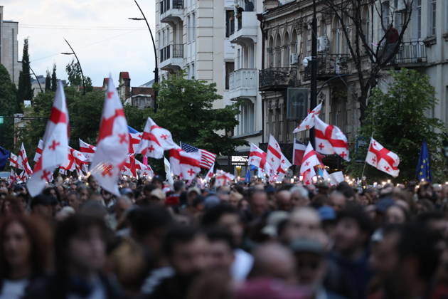 Anti-government protest in Tbilisi TBILISI, GEORGIA - MAY 26: Pro-EU demonstrators wave national flags of Georgia, the European Union, the United States, and Ukraine during an anti-government protest rally outside the Parliament Building on Rustaveli Avenue in Tbilisi, Georgia on May 26, 2026. Organized by the Opposition Alliance , a coalition of various pro-Western opposition political parties, the peaceful demonstration began in the evening hours outside the main entrance of Ivane Javakhishvili Tbilisi State University before marching through the central streets of the capital. Thousands of participants chanted anti-government slogans and accused the ruling party of executing ineffective foreign policies that threaten to derail Georgia s  Copyright: x2026xAnadoluxDavitxKachkachishvilix