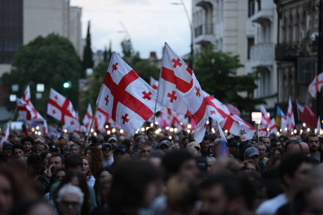 Anti-government protest in Tbilisi TBILISI, GEORGIA - MAY 26: Pro-EU demonstrators wave national flags of Georgia, the European Union, the United States, and Ukraine during an anti-government protest rally outside the Parliament Building on Rustaveli Avenue in Tbilisi, Georgia on May 26, 2026. Organized by the Opposition Alliance , a coalition of various pro-Western opposition political parties, the peaceful demonstration began in the evening hours outside the main entrance of Ivane Javakhishvili Tbilisi State University before marching through the central streets of the capital. Thousands of participants chanted anti-government slogans and accused the ruling party of executing ineffective foreign policies that threaten to derail Georgia s  Copyright: x2026xAnadoluxDavitxKachkachishvilix