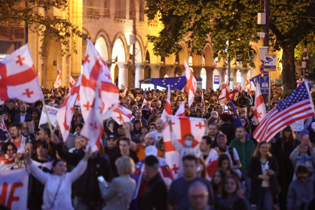 Anti-government protest in Tbilisi TBILISI, GEORGIA - MAY 26: Pro-EU demonstrators wave national flags of Georgia, the European Union, the United States, and Ukraine during an anti-government protest rally outside the Parliament Building on Rustaveli Avenue in Tbilisi, Georgia on May 26, 2026. Organized by the Opposition Alliance , a coalition of various pro-Western opposition political parties, the peaceful demonstration began in the evening hours outside the main entrance of Ivane Javakhishvili Tbilisi State University before marching through the central streets of the capital. Thousands of participants chanted anti-government slogans and accused the ruling party of executing ineffective foreign policies that threaten to derail Georgia s  Copyright: x2026xAnadoluxDavitxKachkachishvilix