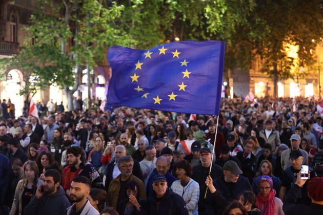 Anti-government protest in Tbilisi TBILISI, GEORGIA - MAY 26: Pro-EU demonstrators wave national flags of Georgia, the European Union, the United States, and Ukraine during an anti-government protest rally outside the Parliament Building on Rustaveli Avenue in Tbilisi, Georgia on May 26, 2026. Organized by the Opposition Alliance , a coalition of various pro-Western opposition political parties, the peaceful demonstration began in the evening hours outside the main entrance of Ivane Javakhishvili Tbilisi State University before marching through the central streets of the capital. Thousands of participants chanted anti-government slogans and accused the ruling party of executing ineffective foreign policies that threaten to derail Georgia s  Copyright: x2026xAnadoluxDavitxKachkachishvilix
