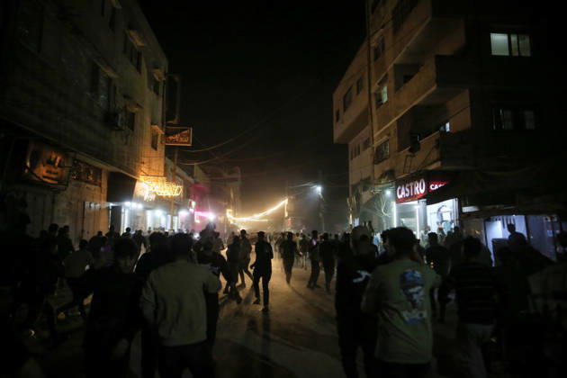 Gaza Rimal District Rocked Strikes Palestinians gather at the site of an airstrike in the Al-Rimal neighborhood of central Gaza City on May 26, 2026, after seven Israeli airstrikes hit a residential building and caused heavy damage to nearby vehicles and commercial shops. Several people were killed and others injured in the strikes, including passersby who had been shopping ahead of Eid. Gaza Gaza Strip Palestinian Territories Copyright: xSaeedxJarasx