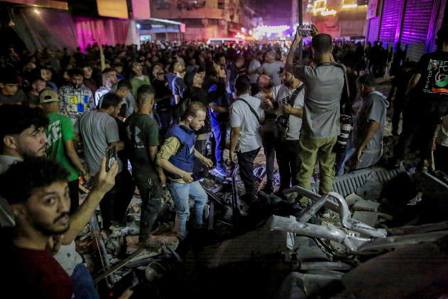 Gaza Rimal District Rocked Strikes Palestinians gather at the site of an airstrike in the Al-Rimal neighborhood of central Gaza City on May 26, 2026, after seven Israeli airstrikes hit a residential building and caused heavy damage to nearby vehicles and commercial shops. Several people were killed and others injured in the strikes, including passersby who had been shopping ahead of Eid. Gaza Gaza Strip Palestinian Territories Copyright: xSaeedxJarasx