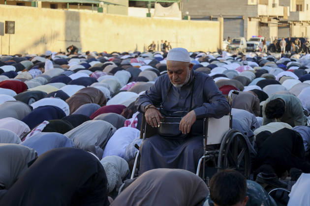 Eid Al-Adha Prayers Idlib A man sits in a wheelchair among a crowd bowing during Eid al-Adha prayers in Idlib, Syria, on May 27, 2026. Eid al-Adha, or the Feast of Sacrifice, is one of the most important holidays in the Islamic calendar, commemorating the willingness of Prophet Ibrahim to sacrifice his son. The event is traditionally marked worldwide by communal prayers, family gatherings, acts of charity, and the slaughtering of livestock. Idlib Idlib Syria Copyright: xOmarxAlbawx