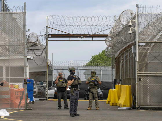 May 27, 2026, Newark, New Jersey, USA: ICE agents wearing bullet-proof vests stand outside of Delaney Hall ICE detention center as detainees inside continue their hunger and labor strike over inhumane conditions and due process violations. Supporters of the detainees are nearby. Newark USA - ZUMAd155 20260527_znp_d155_008 Copyright: xSuexDorfmanx