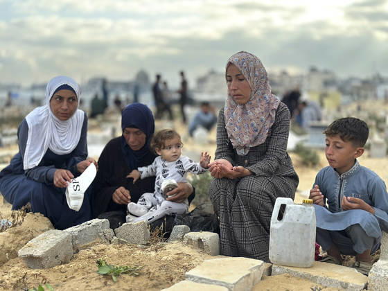 Eid Al Adha Cemetery Memorial Khan Yunis People gather next to a grave to offer prayers during Eid al-Adha at a cemetery in Khan Yunis, Gaza Strip, on May 27, 2026. Eid al-Adha, or the Feast of Sacrifice, is one of the most important holidays in the Islamic calendar, commemorating the willingness of Prophet Ibrahim to sacrifice his son. The event is traditionally marked worldwide by communal prayers, family gatherings, acts of charity, and the slaughtering of livestock. In Gaza, the ongoing conflict has significantly impacted traditional observances, leading to residents substituting fresh livestock with frozen meat and visiting the graves of those killed during the war. Khan Yunis Gaza Strip Palestinian Territories Copyright: xDoaaxAlbazx
