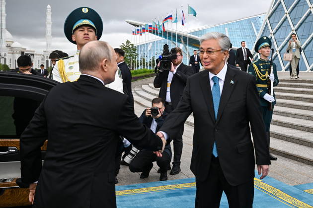 KAZAKHSTAN, ASTANA - MAY 28, 2026: Russia s President Vladimir Putin and Kazakhstan s President Kassym-Jomart Tokayev (L-R front) shake hands during a welcome ceremony outside the Independence Palace. Sergei Bobylev TASS  93123011
