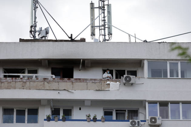 (260529) -- GALATI, May 29, 2026 -- A staff worker checks the residential apartment building damaged by a Russian drone in Galati, Romania, May 29, 2026. At least two people were injured after a drone struck a residential apartment building in Galati, Romania, near the border with Ukraine, local media reported Friday. (Photo by Xinhua) ROMANIA-GALATI-DRONE CristianxCristel 