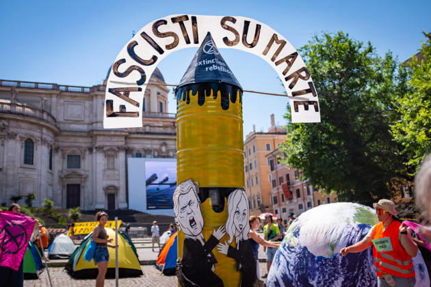 May 30, 2026, Rome, Rm, Italy: Extinction Rebellion activists are launching a 24-hour rally in Piazza dell Esquilino, just days before the 80th anniversary of the Italian Republic on June 2nd. They say: there is nothing to celebrate as long as rights, justice, and dignity continue to be denied. Oil extraction is imposed through violence and war to produce ever more energy, further increasing inequality. Activists pinned drawings of Donald Trump and Giorgia Meloni to a rocket made of oil drums. It reads: Fascists on Mars. Rome Italy  - ZUMAg256 20260530_znp_g256_005 Copyright: xMarcoxDixGianvitox