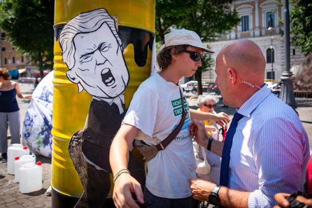 May 30, 2026, Rome, Rm, Italy: Extinction Rebellion activists are launching a 24-hour rally in Piazza dell Esquilino, just days before the 80th anniversary of the Italian Republic on June 2nd. They say: there is nothing to celebrate as long as rights, justice, and dignity continue to be denied. Oil extraction is imposed through violence and war to produce ever more energy, further increasing inequality. Plainclothes police remove drawings of Donald Trump and Giorgia Meloni pinned to a rocket made of oil drums. Rome Italy - ZUMAg256 20260530_znp_g256_010 Copyright: xMarcoxDixGianvitox