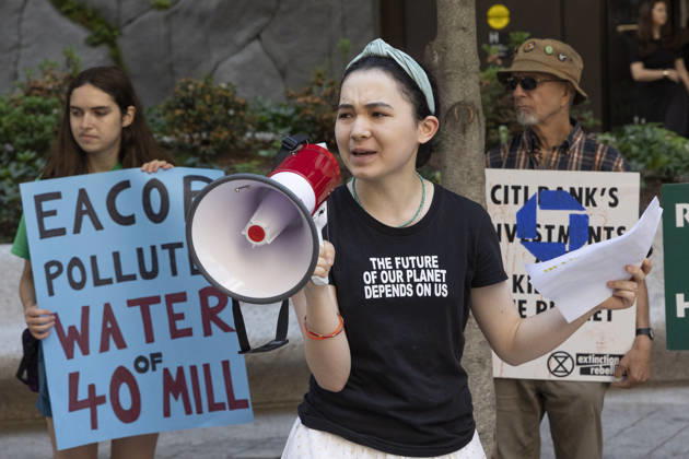 May 29, 2026, New York, New York, USA: Climate activists protesting Chase bankÃ¢â‚¬â ¢s support of Total EnergiesÃ¢â‚¬â ¢ East African Crude Oil Pipeline (EACOP) rally and blockade entrances to JP Morgan Chase headquarters in Midtown Manhattan before blocking traffic on Park Avenue outside the building, resulting in arrests by NYPD. Teenage climate activist AVERY TSAI speaks at the rally wearing a shirt that reads THE FUTURE OF OUR PLANET DEPENDS ON US. Demonstrators join the Kick Polluters Out Global Week of Action denouncing the pipeline for causing displacement of farmers in Uganda and Tanzania and damage to protected waterways, biodiversity areas and ecosystems. Organizations involved in the protest include Planet Over Profit, Extin  - ZUMAr174 20260529_znp_r174_024 Copyright: xGinaxMxRandazzox
