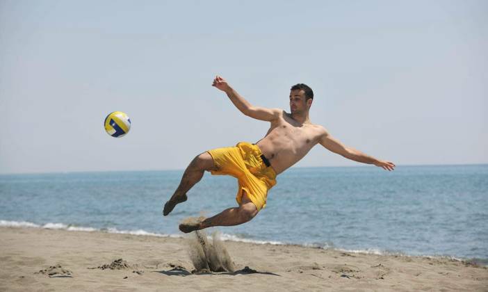 male beach volleyball game player jump on hot sand model released Symbolfoto Copyright: xdotshockx Panthermedia68633046.jpg