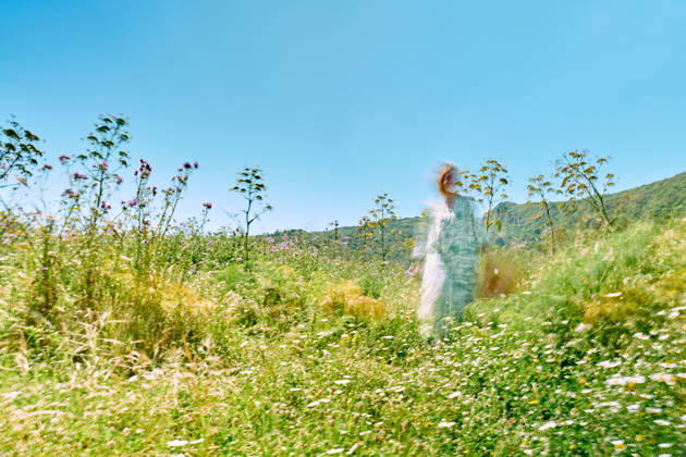 Ethereal woman in a peaceful spring wildflower meadow model released, Symbolfoto, CATF01004