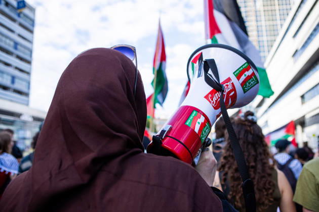 June 5, 2026, Berlin, Berlin, Germany: A protester carrying a megaphone stands among demonstrators and Palestinian flags during a Naksa Day event in Berlin. Berlin Germany - ZUMAc291 20260605_zip_c291_005 Copyright: xMariaxCastrox