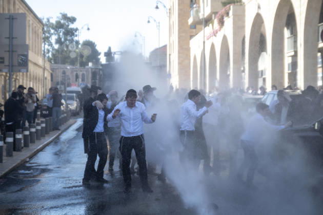 Police intervene as Ultra-Orthodox Jews block roads in West Jerusalem WEST JERUSALEM - JUNE 10: Israeli police use stun grenades and water cannons to disperse Ultra-Orthodox (Haredi) Jews blocking roads during a protest on June 10, 2026. Three demonstrators were detained during the incidents in West Jerusalem, where crowds gathered to protest against compulsory military service. Mostafa Alkharouf Anadolu Jerusalem Israel. Editorial use only. Please get in touch for any other usage.  Copyright: x2026xAnadoluxMostafaxAlkharoufx