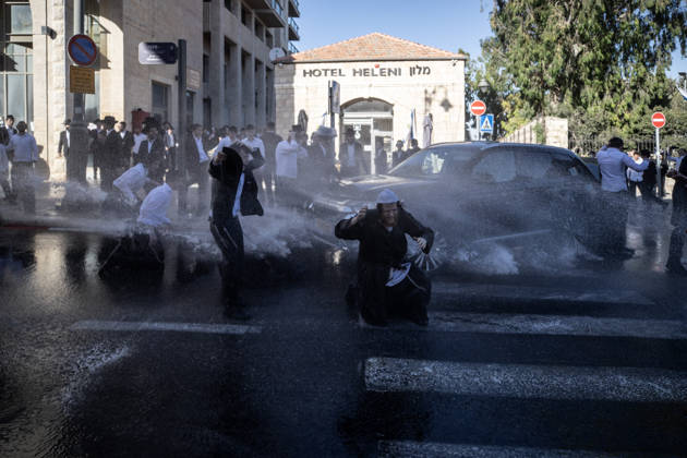 Police intervene as Ultra-Orthodox Jews block roads in West Jerusalem WEST JERUSALEM - JUNE 10: Israeli police use stun grenades and water cannons to disperse Ultra-Orthodox (Haredi) Jews blocking roads during a protest on June 10, 2026. Three demonstrators were detained during the incidents in West Jerusalem, where crowds gathered to protest against compulsory military service. Mostafa Alkharouf Anadolu Jerusalem Israel. Editorial use only. Please get in touch for any other usage.  Copyright: x2026xAnadoluxMostafaxAlkharoufx