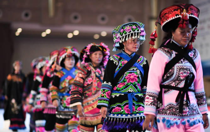 (260612) -- KUNMING, June 12, 2026 -- A team composed of local people from Yunnan Province s Chuxiong performs at the opening ceremony of a fashion week during the China-South Asia Expo in Kunming, southwest China s Yunnan Province, June 12, 2026. The fashion week kicked off here on Friday, as part of the 10th edition of the China-South Asia Expo which is held from June 11 to 16 in Kunming. ) CHINA-YUNNAN-KUNMING-CHINA-SOUTH ASIA EXPO-FASHION WEEK (CN) JiangxWenyao 
