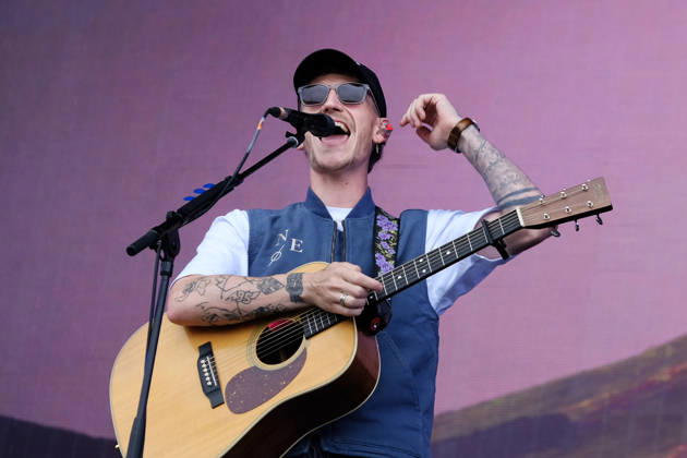 June 20, 2026, Newport, United Kingdom: Scottish singer songwriter Nathan Evans born Nathan Alexander Evans, performing live on stage with The Saint PHNX Band at the Isle of Wight festival. He first gained fame in 2020 by posting videos of himself singing sea shanties on TikTok. In 2021, he released a version of the folk song Wellerman which peaked at the top of the UK Singles Chart. The Saint PHNX Band is currently Nathan Evans Lead vocals and acoustic guitar., Stevie Jukes Lead vocals, guitar, and bass, Alan Jukes Backing vocals, drums, and percussion Newport United Kingdom - ZUMAs197 20260620_aaa_s197_144 Copyright: xDawnxFletcher-Parkx