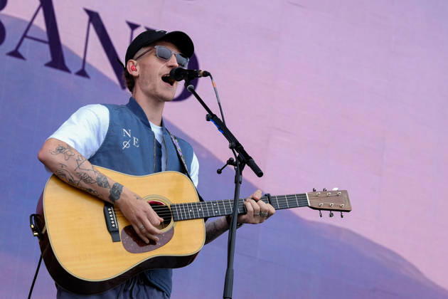 June 20, 2026, Newport, United Kingdom: Scottish singer songwriter Nathan Evans born Nathan Alexander Evans, performing live on stage with The Saint PHNX Band at the Isle of Wight festival. He first gained fame in 2020 by posting videos of himself singing sea shanties on TikTok. In 2021, he released a version of the folk song Wellerman which peaked at the top of the UK Singles Chart. The Saint PHNX Band is currently Nathan Evans Lead vocals and acoustic guitar., Stevie Jukes Lead vocals, guitar, and bass, Alan Jukes Backing vocals, drums, and percussion Newport United Kingdom - ZUMAs197 20260620_aaa_s197_145 Copyright: xDawnxFletcher-Parkx