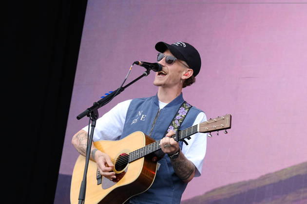 June 20, 2026, Newport, United Kingdom: Scottish singer songwriter Nathan Evans born Nathan Alexander Evans, performing live on stage with The Saint PHNX Band at the Isle of Wight festival. He first gained fame in 2020 by posting videos of himself singing sea shanties on TikTok. In 2021, he released a version of the folk song Wellerman which peaked at the top of the UK Singles Chart. The Saint PHNX Band is currently Nathan Evans Lead vocals and acoustic guitar., Stevie Jukes Lead vocals, guitar, and bass, Alan Jukes Backing vocals, drums, and percussion Newport United Kingdom - ZUMAs197 20260620_aaa_s197_153 Copyright: xDawnxFletcher-Parkx