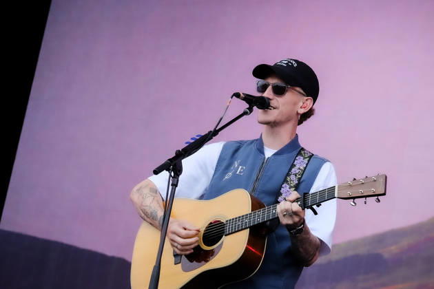 June 20, 2026, Newport, United Kingdom: Scottish singer songwriter Nathan Evans born Nathan Alexander Evans, performing live on stage with The Saint PHNX Band at the Isle of Wight festival. He first gained fame in 2020 by posting videos of himself singing sea shanties on TikTok. In 2021, he released a version of the folk song Wellerman which peaked at the top of the UK Singles Chart. The Saint PHNX Band is currently Nathan Evans Lead vocals and acoustic guitar., Stevie Jukes Lead vocals, guitar, and bass, Alan Jukes Backing vocals, drums, and percussion Newport United Kingdom - ZUMAs197 20260620_aaa_s197_166 Copyright: xDawnxFletcher-Parkx
