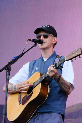 June 20, 2026, Newport, United Kingdom: Scottish singer songwriter Nathan Evans born Nathan Alexander Evans, performing live on stage with The Saint PHNX Band at the Isle of Wight festival. He first gained fame in 2020 by posting videos of himself singing sea shanties on TikTok. In 2021, he released a version of the folk song Wellerman which peaked at the top of the UK Singles Chart. The Saint PHNX Band is currently Nathan Evans Lead vocals and acoustic guitar., Stevie Jukes Lead vocals, guitar, and bass, Alan Jukes Backing vocals, drums, and percussion Newport United Kingdom - ZUMAs197 20260620_aaa_s197_169 Copyright: xDawnxFletcher-Parkx