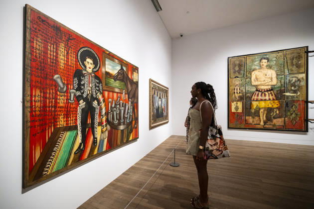 June 22, 2026, London, London, UK: LONDON, UK. Staff with (L) Ã¢â‚¬ËœLos coÂ³mplices The AccomplicesÃ¢â‚¬â ¢ 1987, by Julio GaloÂ¡n at a preview of Frida: The Making of an Icon, a new exhibition at Tate Modern tracing Mexican painterÃ¢â‚¬â ¢s KahloÃ¢â‚¬â ¢s transformation from relatively unknown painter to global cultural phenomenon. Over 30 original works by Frida Kahlo alongside other works are on show runs 25 June 2026 to 3 January 2027. London UK  - ZUMAl94_ 20260622_zaf_l94_043 Copyright: xStephenxChungx