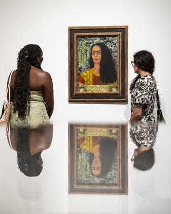 June 22, 2026, London, London, UK: LONDON, UK. Staff with Ã¢â‚¬ËœAutorretrato con el pelo suelto Self-Portrait with Loose HairÃ¢â‚¬â ¢, 1947, at a preview of Frida: The Making of an Icon, a new exhibition at Tate Modern tracing Mexican painterÃ¢â‚¬â ¢s KahloÃ¢â‚¬â ¢s transformation from relatively unknown painter to global cultural phenomenon. Over 30 original works by Frida Kahlo alongside other works are on show runs 25 June 2026 to 3 January 2027. London UK  - ZUMAl94_ 20260622_zaf_l94_051 Copyright: xStephenxChungx