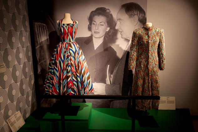 Exhibition: Fashion in Light 1955 1975 ROME, ITALY - JUNE 25: Cocktail Dress, Sorelle Fontana, circa 1953, in printed cotton and tarlatan with polychrome abstract patterns in shades of coral red, light and dark blue, pink, brown and white, (L), Capotto by Laura Biagiotti , circa 1972, long coat in fur-stitch knit, characterized by a multicolored palette in shades of turquoise, orange and purple. (R) during the Exhibition Fashion in Light 1955 1975, Rome: between glamour and industrial innovation, featuring cinema, style, the great fashion designers, timeless brands, and the stars of the silver screen and haute couture, at the Capitoline Museums, Centrale Montemartini on June 25, 2026 in Rome, Italy. Rome Italy Copyright: xStefanoxMontesix