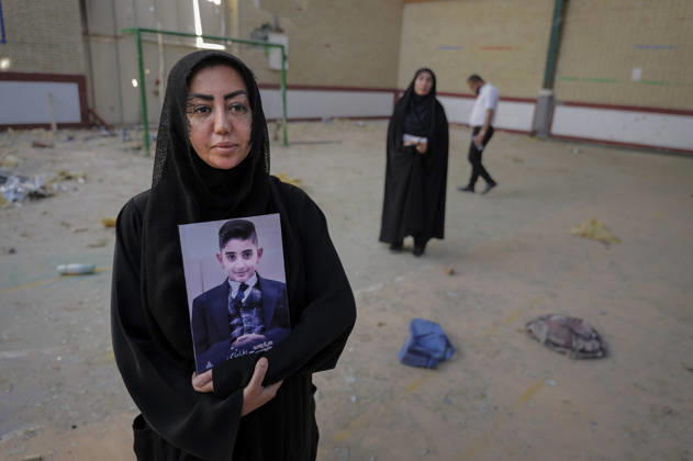 Iran Lamerd Sports Facility Missile Strikes Aftermath A woman holds a portrait of a child inside a damaged sports hall in Lamerd, Fars Province, Iran, on June 4, 2026. On February 28, 2026, a two-missile strike hit the facility while a women s volleyball team used it, killing at least 21 people and injuring around 100 others. Independent investigations concluded a United States Precision Strike Missile was used in the attack, though the United States Central Command denied responsibility. Lamerd Fars Iran Copyright: xLaurinxStrelex