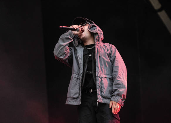 Kneecap performing live at Crystal Palace Park, London 27 June 2026 Kneecap performing live at Crystal Palace Park, London 27 June 2026 Moglai Bap (Naoise O Caireallai) - rapper, vocals Kneecap are an Irish hip-hop trio. They rap in a mixture of English and Irish. Their first single C.E.A.R.T.A. (cearta is Irish for rights ) was released in ˜17, followed by their mixtape, 3CAG, in ˜18. Their first studio album, Fine Art, was released in ˜24 Their second studio album, Fenian, was released in ˜26. The group has been at the centre of public debates about free speech and the expression of political opinions within Ireland and the UK. Their themes focus on working class, youth culture, Irish republicanism and Irish language rights Copyright: xDafyddxOwenx xDafyddxOwenx-xB5377x xAvalonx 1112995617