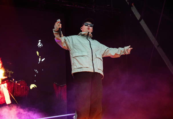 Kneecap performing live at Crystal Palace Park, London 27 June 2026 Kneecap performing live at Crystal Palace Park, London 27 June 2026 Mo Chara (Liam Og O hAnnaidh) - rapper, vocals Kneecap are an Irish hip-hop trio. They rap in a mixture of English and Irish. Their first single C.E.A.R.T.A. (cearta is Irish for rights ) was released in ˜17, followed by their mixtape, 3CAG, in ˜18. Their first studio album, Fine Art, was released in ˜24 Their second studio album, Fenian, was released in ˜26. The group has been at the centre of public debates about free speech and the expression of political opinions within Ireland and the UK. Their themes focus on working class, youth culture, Irish republicanism and Irish language rights. In Copyright: xDafyddxOwenx xDafyddxOwenx-xB5377x xAvalonx 1112995958