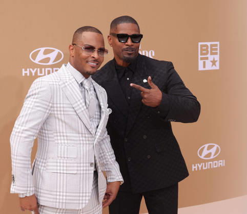 (L-R) T.I. and Jamie Foxx arrive on the red carpet for 26th annual BET Awards live telecast at the Peacock Theater in Los Angeles on Sunday, June 28, 2026. The BET Awards honors Black entertainers and other people of color in music, film, sports and philanthropy.  LAP20260628306 GREGxGRUDT
