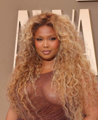 Lizzo arrives on the red carpet for 26th annual BET Awards live telecast at the Peacock Theater in Los Angeles on Sunday, June 28, 2026. The BET Awards honors Black entertainers and other people of color in music, film, sports and philanthropy.  LAP20260628412 GREGxGRUDT