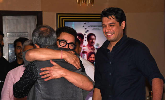 July 2, 2026, Mumbai, Maharashtra, India: Bollywood actor Aamir Khan (L) hugs filmmaker Rajkumar Hirani as actor Junaid Khan (R) looks on at the screening of web series Pritam & Pedro in Mumbai. Mumbai India  - ZUMAs197 20260702_aaa_s197_207 Copyright: xAshishxVaishnavx