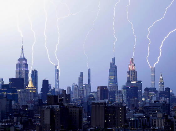 Bolts of lightning fill the Manhattan skyline and strike multiple skyscrapers including the Empire State Building and One Vanderbil in an early evening thunderstorm one day before the July 4th holiday and the 250th anniversary of the United States on Friday July 3, 2026 in New York City.  NYP202607033008 JOHNxANGELILLO