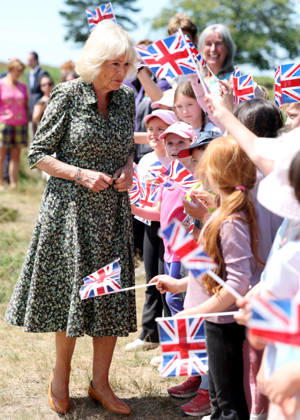 . 07 07 2026. Ashdown Forest. United Kingdom. Queen Camilla during a visit to Ashdown Forest, United Kingdom , to commemorate 100 years of Winnie-the-Pooh . During the visit she played a game of pooh sticks on pooh sticks bridge with children .  xPoolx xi-Imagesx IIM-26893-0021