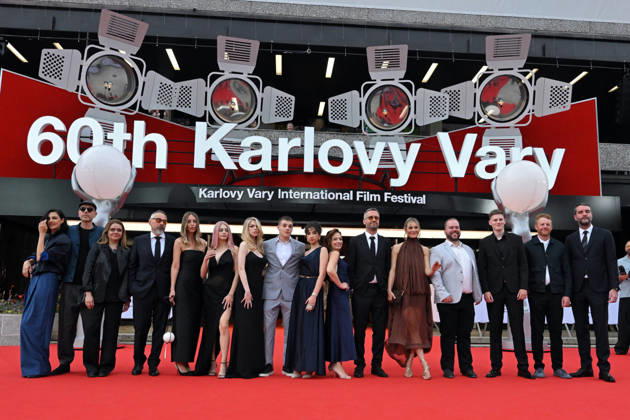 The 60th Karlovy Vary International Film Festival continued on its fifth day, in Karlovy Vary, Czech Republic, on July 7, 2026. A delegation of filmmakers presented the competition film Three Weeks Later (Serbia, Bulgaria, Italy, Croatia, Luxembourg) in the Grand Ballroom of the Thermal Hotel. Director Miroslav Terzic is standing the fourth from left (wearing glasses and a goatee beard). (CTKxPhoto SlavomirxKubes) CTKPhotoP2026070709532  CTKPhotoP2026070709532