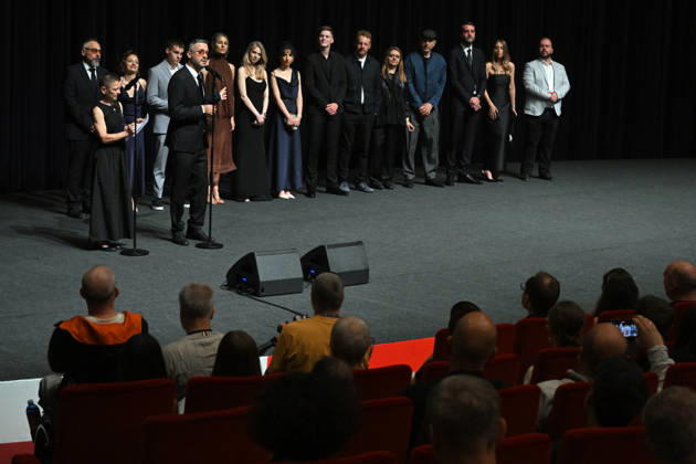 The 60th Karlovy Vary International Film Festival continued on its fifth day, in Karlovy Vary, Czech Republic, on July 7, 2026. A delegation of filmmakers presented the competition film Three Weeks Later (Serbia, Bulgaria, Italy, Croatia, Luxembourg) in the Grand Ballroom of the Thermal Hotel. Director Miroslav Terzic is standing backward left (wearing glasses and a goatee beard), in front of him stands interpreter of the Karlovy Vary Festival Helena Koutna, to microphone speaks producer Branislav Trifunovic. (CTKxPhoto SlavomirxKubes) CTKPhotoP2026070709546 CTKPhotoP2026070709546