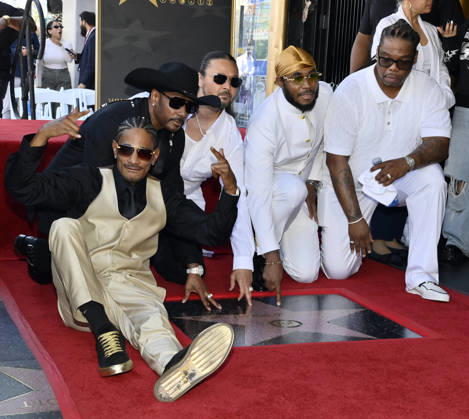 Layzie Bone, Krayzie Bone, Bizzy Bone, Flesh-n-Bone and Wish Bone (L-R) of the Hip-Hop group Bone Thugs-N-Harmony gather around their star during a ceremony honoring them with the 2,851st star on the Hollywood Walk of Fame in Los Angeles on Wednesday, July 8, 2026.  LAP2026070802 JIMxRUYMEN