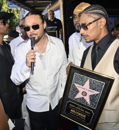 Bizzy Bone (L) and Layzie Bone of the Hip-Hop group Bone Thugs-N-Harmony speak with reporters during a ceremony honoring them with the 2,851st star on the Hollywood Walk of Fame in Los Angeles on Wednesday, July 8, 2026.  LAP2026070824 JIMxRUYMEN