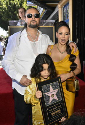Bizzy Bone (L) of the Hip-Hop group Bone Thugs-N-Harmony is joined by his wife Jessica Cassidy and their son Jessy Anderson during a ceremony honoring them with the 2,851st star on the Hollywood Walk of Fame in Los Angeles on Wednesday, July 8, 2026.  LAP2026070827 JIMxRUYMEN