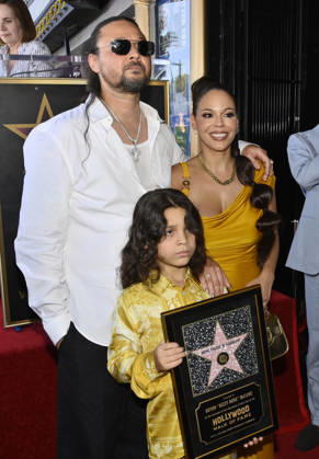 Bizzy Bone (L) of the Hip-Hop group Bone Thugs-N-Harmony is joined by his wife Jessica Cassidy and their son Jessy Anderson during a ceremony honoring them with the 2,851st star on the Hollywood Walk of Fame in Los Angeles on Wednesday, July 8, 2026.  LAP2026070828 JIMxRUYMEN